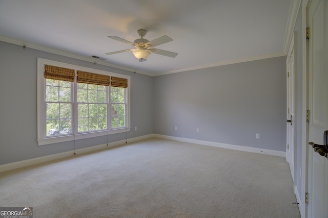 unfurnished room with light colored carpet, ornamental molding, and ceiling fan