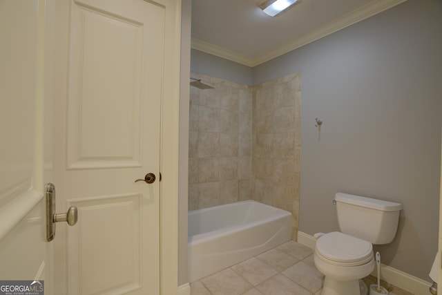 bathroom featuring tile patterned flooring, crown molding, tiled shower / bath combo, and toilet