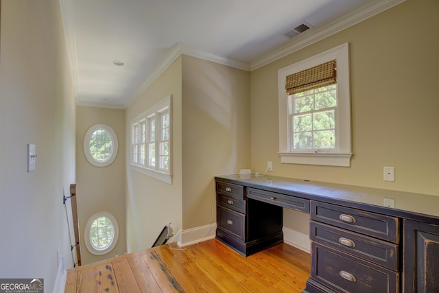 office area featuring crown molding and light hardwood / wood-style flooring