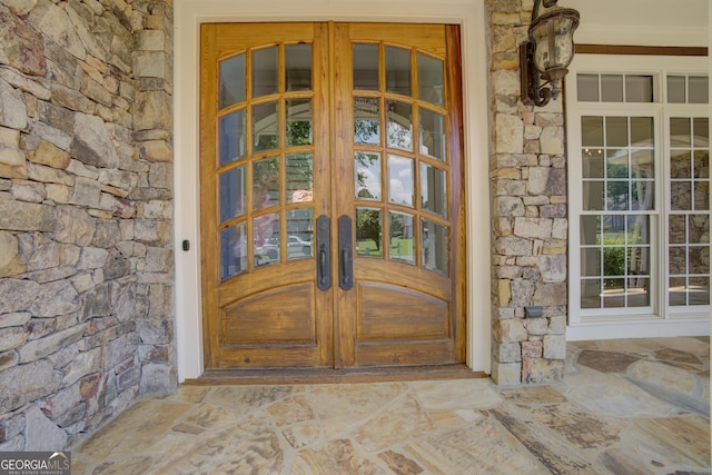 entrance to property featuring french doors