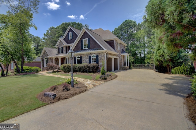 craftsman inspired home with a garage and a front yard