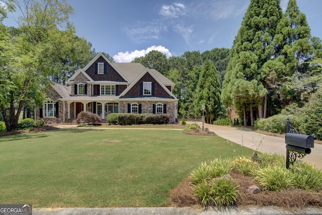 craftsman-style home with a front yard