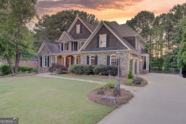 craftsman-style home featuring a yard