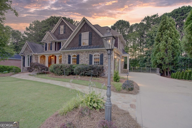 craftsman house with a yard