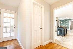 doorway to outside featuring wood-type flooring