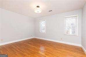 empty room featuring wood-type flooring