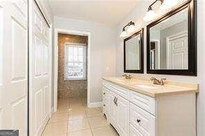 bathroom with vanity and tile patterned flooring