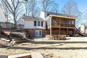 back of property featuring a sunroom