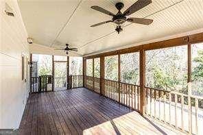 unfurnished sunroom with ceiling fan and a healthy amount of sunlight