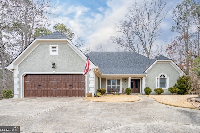 view of front facade with a porch and a garage