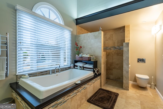 bathroom featuring tile patterned floors and independent shower and bath