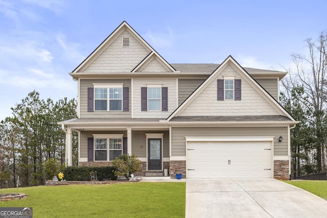 craftsman house featuring a garage, stone siding, concrete driveway, and a front lawn