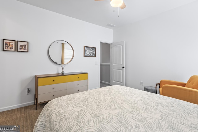 carpeted bedroom featuring visible vents, baseboards, and a ceiling fan