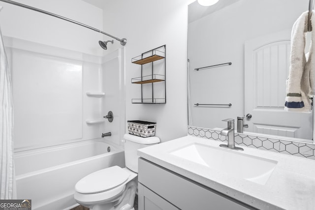 bathroom featuring shower / washtub combination, toilet, and vanity