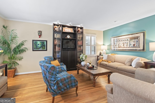 living room featuring light wood-type flooring and ornamental molding