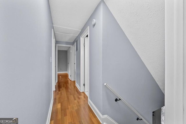 hallway featuring hardwood / wood-style flooring