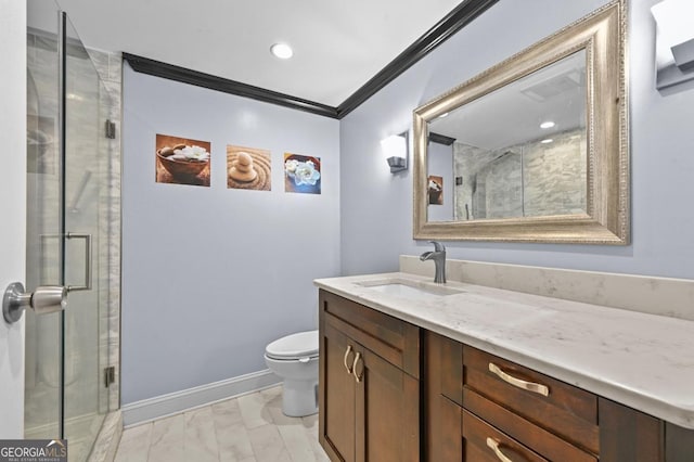 bathroom with crown molding, vanity, toilet, and an enclosed shower