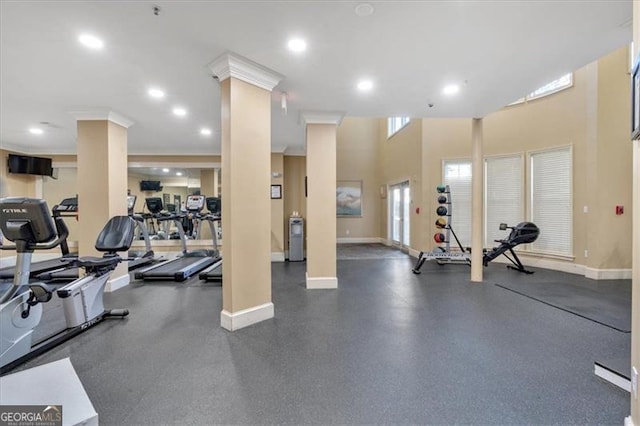 gym with a towering ceiling and ornate columns