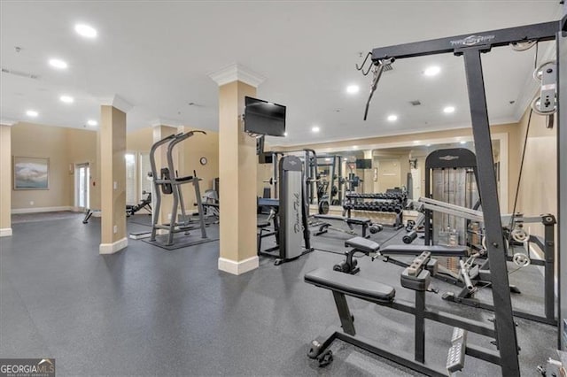 exercise room featuring ornamental molding