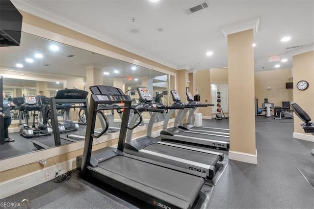 workout area featuring ornamental molding