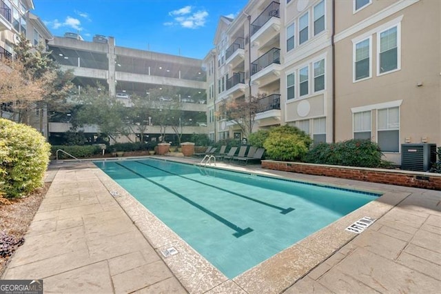 view of pool with central AC