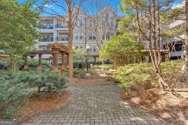 view of home's community with a pergola