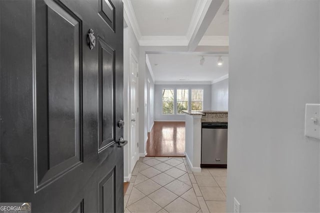 entrance foyer featuring light tile patterned flooring and ornamental molding