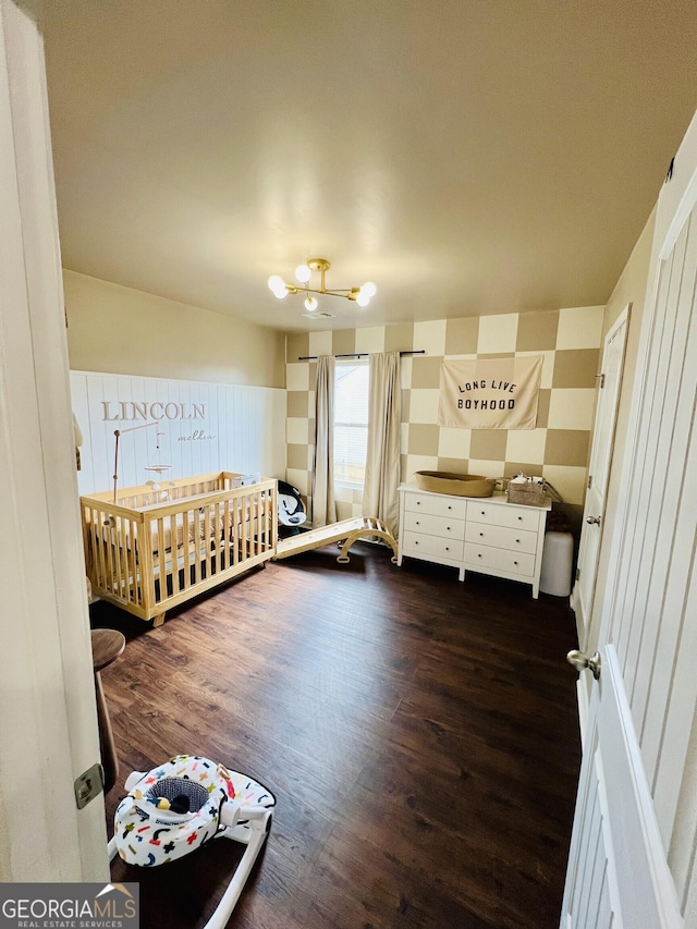 unfurnished bedroom with dark wood-type flooring