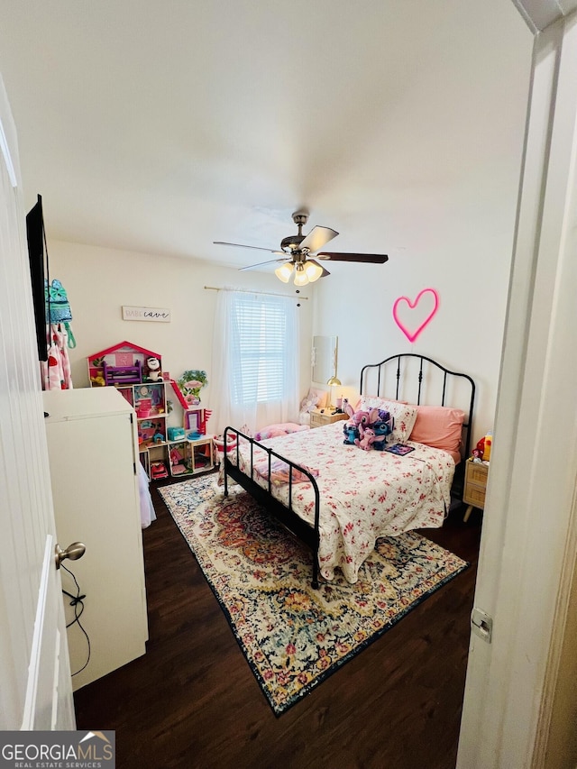 bedroom featuring dark hardwood / wood-style floors and ceiling fan