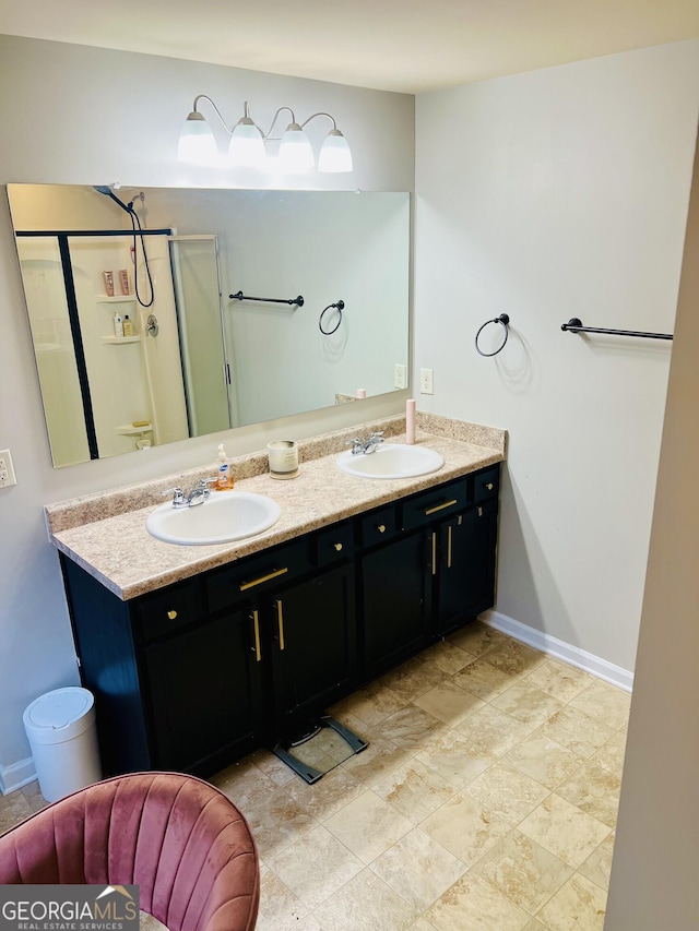 bathroom with vanity and a shower