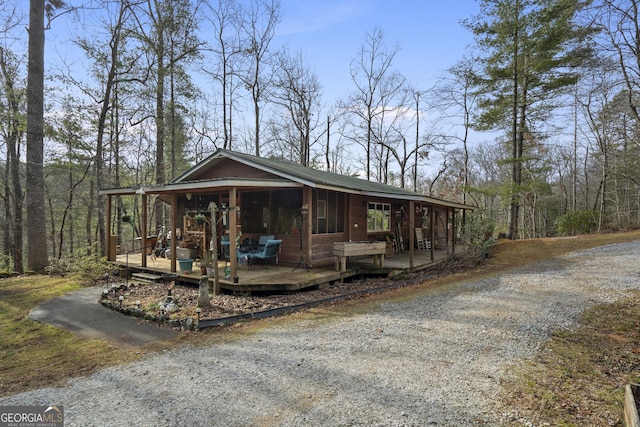 view of front facade with a sunroom