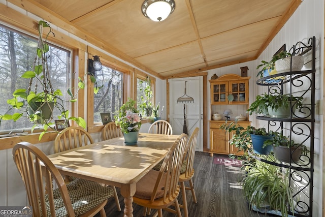 sunroom featuring vaulted ceiling