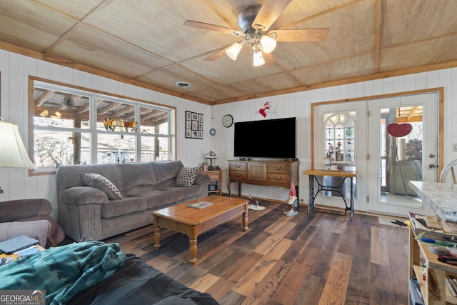 living room with dark hardwood / wood-style floors and ceiling fan