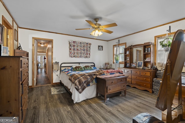 bedroom featuring dark hardwood / wood-style flooring and crown molding