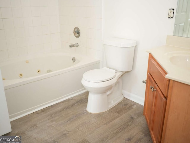 full bathroom with wood-type flooring, vanity, shower / bathtub combination, and toilet