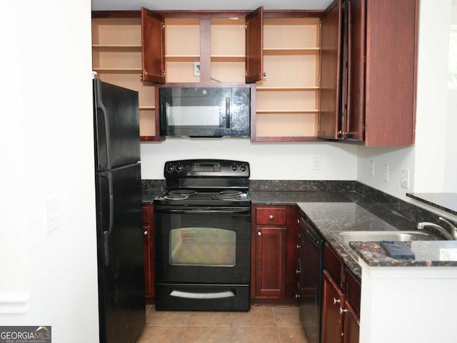 kitchen with light tile patterned floors, dark stone counters, sink, and black appliances