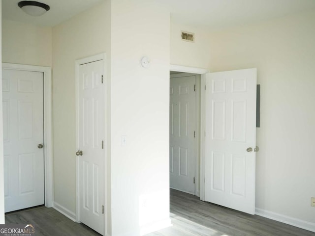 unfurnished bedroom featuring wood-type flooring