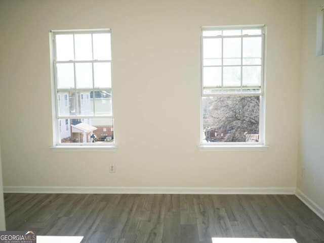 unfurnished room featuring dark hardwood / wood-style floors