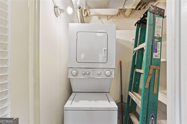 laundry room with stacked washer / dryer