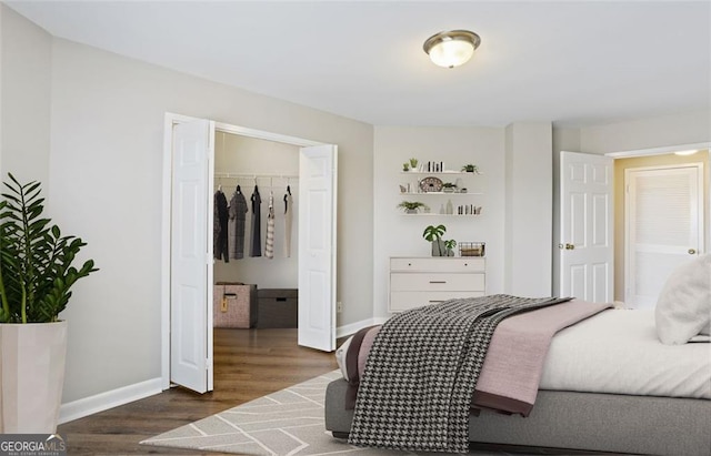 bedroom with dark hardwood / wood-style floors