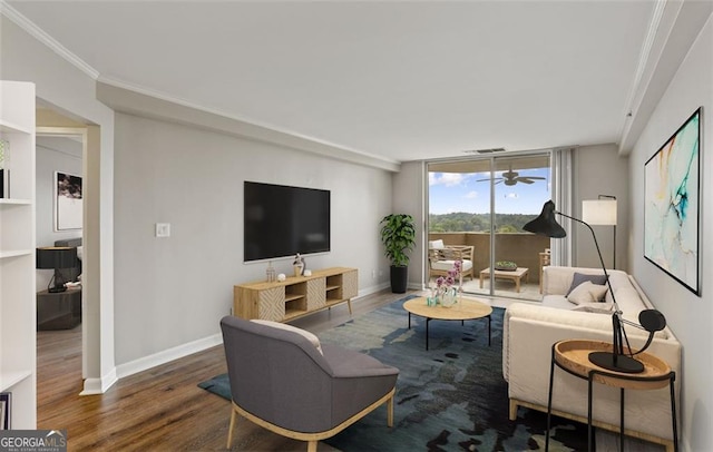 living room featuring hardwood / wood-style flooring, a wall of windows, and crown molding