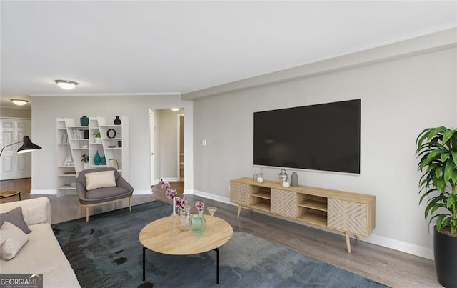 living room with crown molding and dark hardwood / wood-style flooring