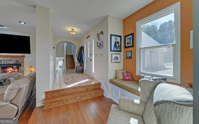 foyer featuring a fireplace and light hardwood / wood-style flooring