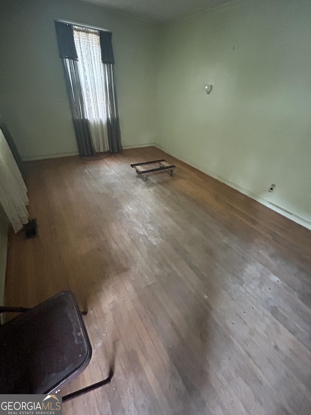 spare room featuring hardwood / wood-style flooring