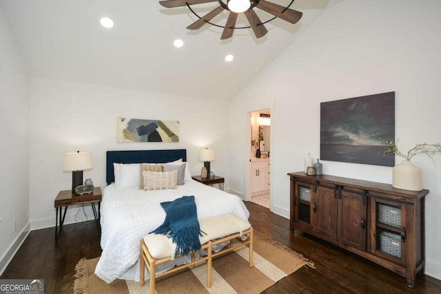 bedroom featuring ceiling fan, ensuite bath, dark hardwood / wood-style flooring, and high vaulted ceiling