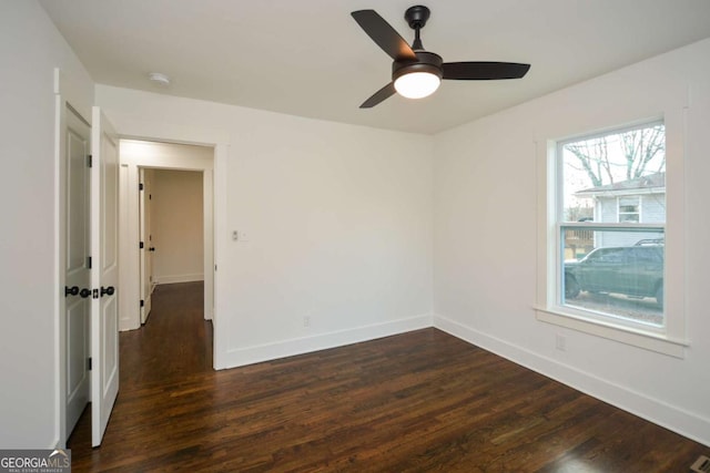 empty room with dark hardwood / wood-style floors