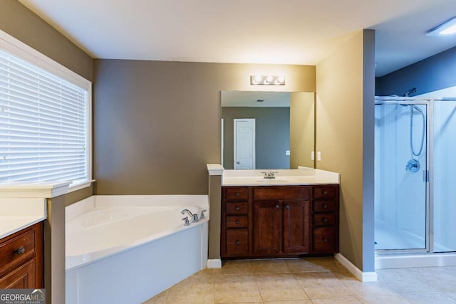 bathroom with independent shower and bath, vanity, and tile patterned floors