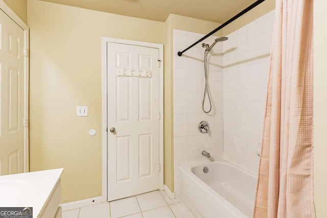 bathroom featuring tile patterned flooring, vanity, and shower / bath combo