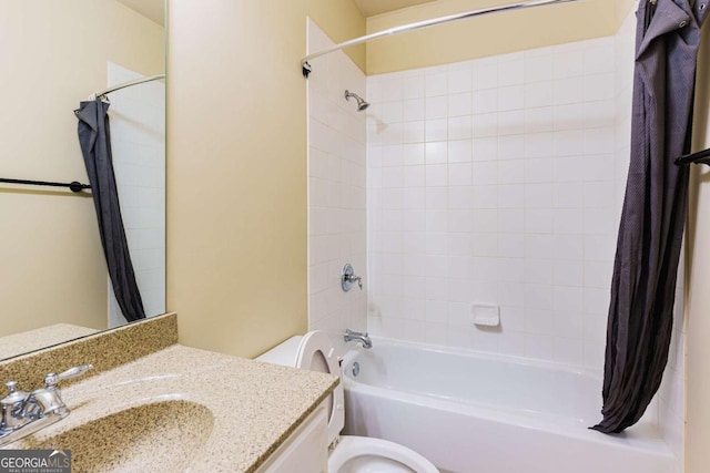 full bathroom with vanity, shower / bath combo, and toilet