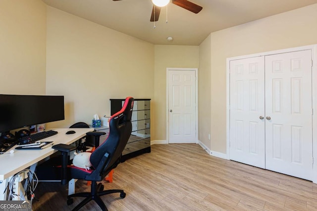 office space featuring ceiling fan and light hardwood / wood-style flooring